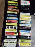 open storage case showing two rows of 8-track tapes