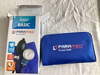 Retail box and blue carrying pouch of Paramed Basic aneroid blood pressure kit