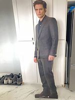 Front view of life-size Edward Cullen cardboard standee showing full figure, base and visible crease