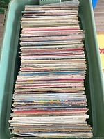 Top view of crate filled with stacked LPs
