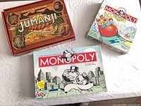 Overview of three board games: Monopoly, Monopoly Junior, Jumanji