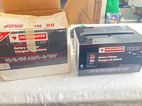 Charger unit alongside original box showing brand, model and specifications