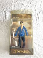 Front view of sealed Edward Cullen action figure in blister packaging