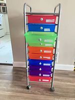 Front view of cart showing all nine drawers and casters