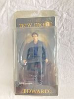 Front view of sealed Edward Cullen action figure in blister packaging