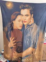 Full view of Twilight New Moon fleece throw blanket showing poster image design