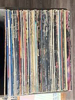 Spines of entire LP collection lined vertically in box