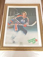 Full view of framed poster showing Wayne Gretzky, 7UP branding, ornate gold frame