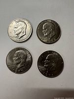 Group shot of four Eisenhower dollars dated 1971, 1972, 1977, 1978