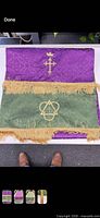 Runner laid flat showing both purple and green sides with gold fringe and embroidery