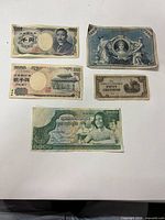 Group shot of all five banknotes laid out