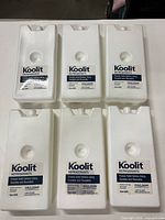 Front view of six Koolit Item 405 gel bottles