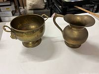 Pedestal bowl and jug side by side