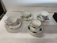 Group shot of four teacup and saucer sets