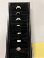 Tray showing all seven rings in slots