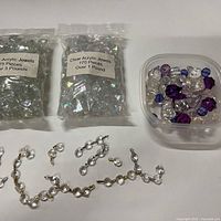 Overview of all acrylic jewel bags, tub, and linked strands