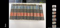 Full set of 10 brown cloth Winston encyclopedias standing in a row