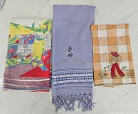 Front view of all three towels laid flat