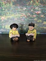 Front view of both ceramic figurines