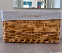 Front view showing wicker weave and folded liner with "Storage" text