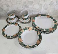 Group shot showing dinner plates, salad plates, soup bowls, cups and saucers with pattern visible