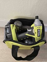 Impact driver with battery inside Ryobi soft bag