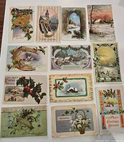 Fronts of 12 assorted Christmas postcards showing various designs