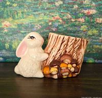 Front view showing rabbit, stump and acorn details