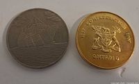 Both medallions front side – ship scene and Ontario coat of arms