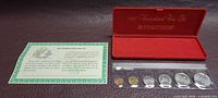 Full set with case, info card, and six coins in plastic strip