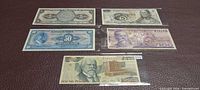 Fronts of all five Banco de Mexico banknotes in sleeves