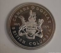 Reverse showing British Columbia coat of arms, dates, denomination