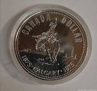 Reverse of 1975 Calgary Centennial dollar in capsule