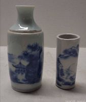 Vase and brush pot side by side to show forms, size relation and decoration