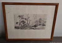 Full view of framed landscape artwork showing frame, mat and image