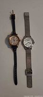 Both Fossil wristwatches side by side showing overall design and straps