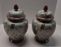 Front view of both ginger jars with lids on