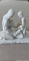 Full view of white resin Holy Family statue on tabletop