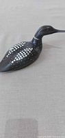 Left side view of carved wooden loon