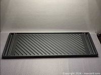 Ridged side of rectangular cast iron griddle
