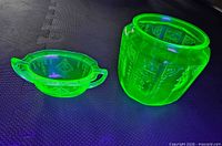 Sugar bowl and jar glowing under UV light