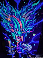 Fluorescent dragon tapestry under blacklight