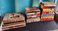 Three stacks of vintage children’s hardcover books on tabletop