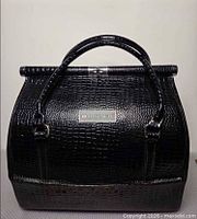 Front view showing brand plate, texture, handles