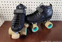 Full view of both skates showing boots, wheels, and closures