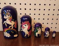 All five unicorn nesting dolls lined up by size
