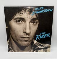 Front cover portrait with album title and artist