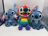 All three Stitch plush toys side by side