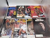 Group photo of eight Sports Illustrated magazines laid out