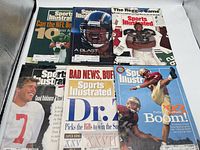 Six magazines laid out showing all covers